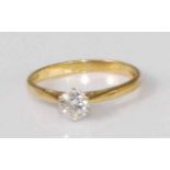 A contemporary 18ct gold diamond solitaire ring, the six claw set brilliant weighing 0.5 carats, 2.