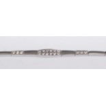 A contemporary two-tone 14ct white gold diamond set sectional bracelet, the centre section pavé