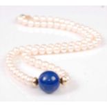 A single row necklet, comprising seventy-two 5.5 to 5.8mm button freshwater pearls with a 13.12mm