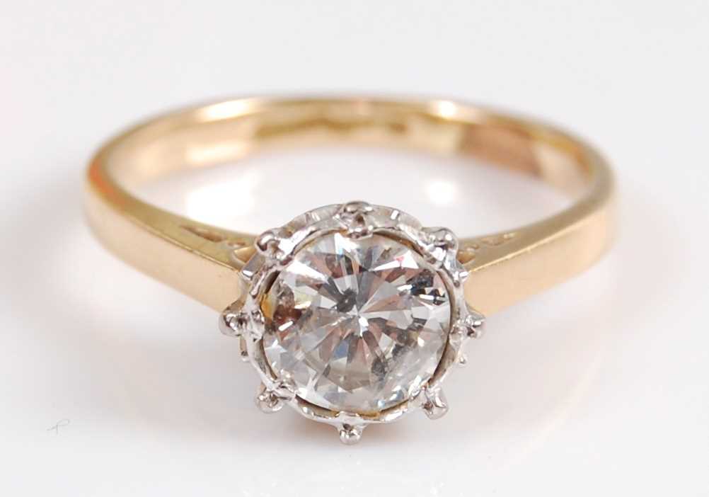 A yellow and white metal diamond single stone ring, featuring an Old European cut diamond in an