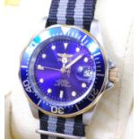 A gent's Invicta steel cased automatic wristwatch, having fixed blue bezel, signed blue dial,