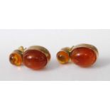 A pair of 14ct gold amber set ear studs, each arranged as two cabochon stones, 5.6g, 22mm