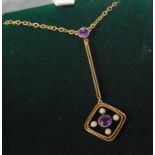 A contemporary 9ct gold, amethyst and seed pearl set drop pendant, of diamond shape, having centre