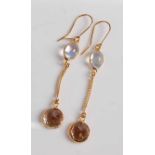A pair of yellow metal, brown zircon and moonstone drop earrings, each featuring a round faceted