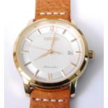 A gent's Seiko gold plated automatic wristwatch, having a signed engine turned dial with baton