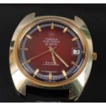 A Gents gold plated Omega electronic chronometer watch, having a round red baton dial with date