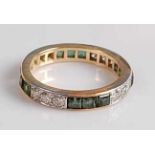 A yellow and white metal, tourmaline and diamond full hoop eternity ring, featuring four alternating