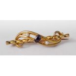 A yellow metal, amethyst and seed pearl set bar brooch, 4.4g, unmarked but tests as approx 18ct,