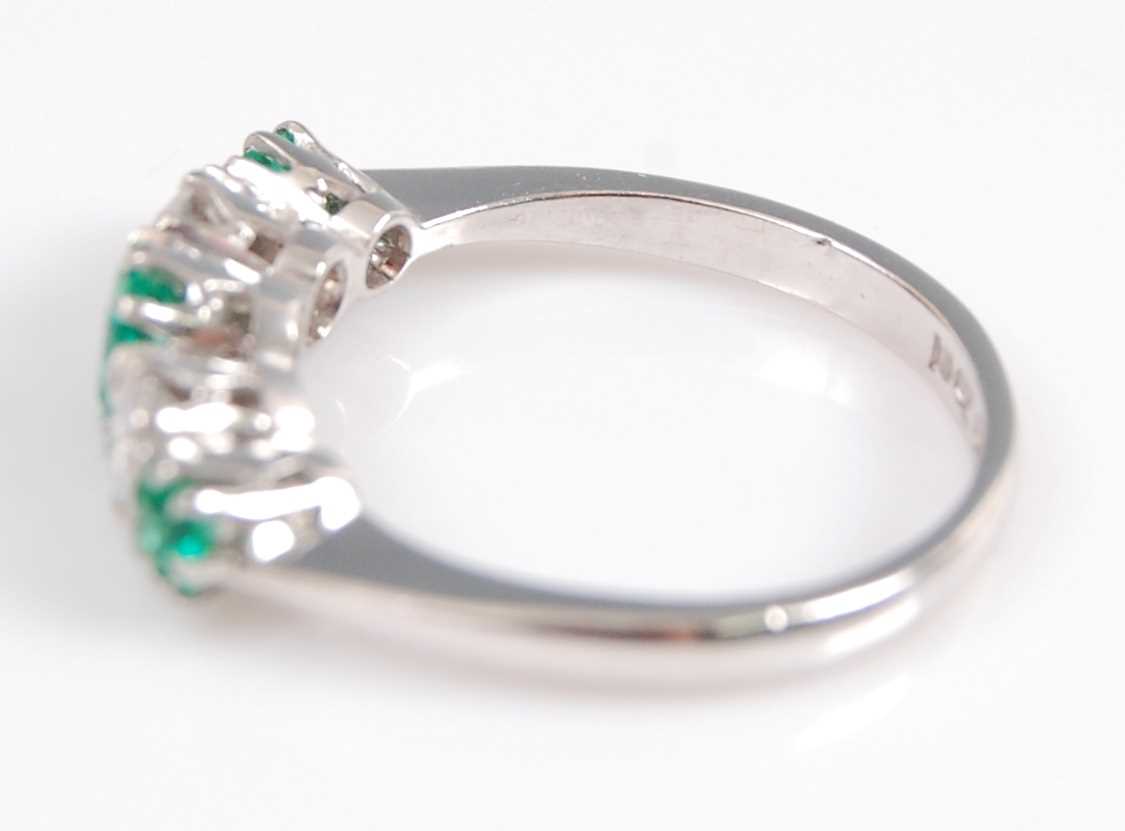 A white metal, emerald and diamond five stone half hoop eternity ring, featuring three graduated - Image 3 of 6