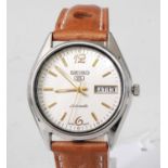 A gent's Seiko 5 Sports steel cased automatic wristwatch, having a signed cream dial with baton