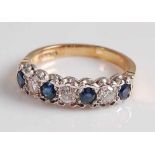 An 18ct yellow and white gold, sapphire and diamond seven stone half-hoop eternity ring, featuring