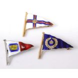 A 9ct gold and polychrome enamel nautical pennant brooch, retailed by Benzie, Cowes, 31mm;
