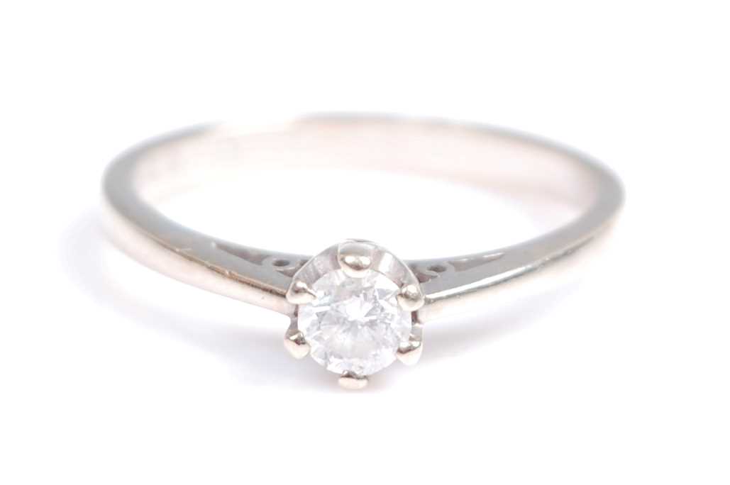 A 9ct white gold single stone diamond ring, comprising a round brilliant cut diamond in a six claw