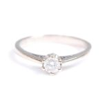 A 9ct white gold single stone diamond ring, comprising a round brilliant cut diamond in a six claw