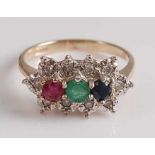 A 9ct yellow and white gold, ruby, emerald, sapphire and diamond triple cluster ring, featuring a
