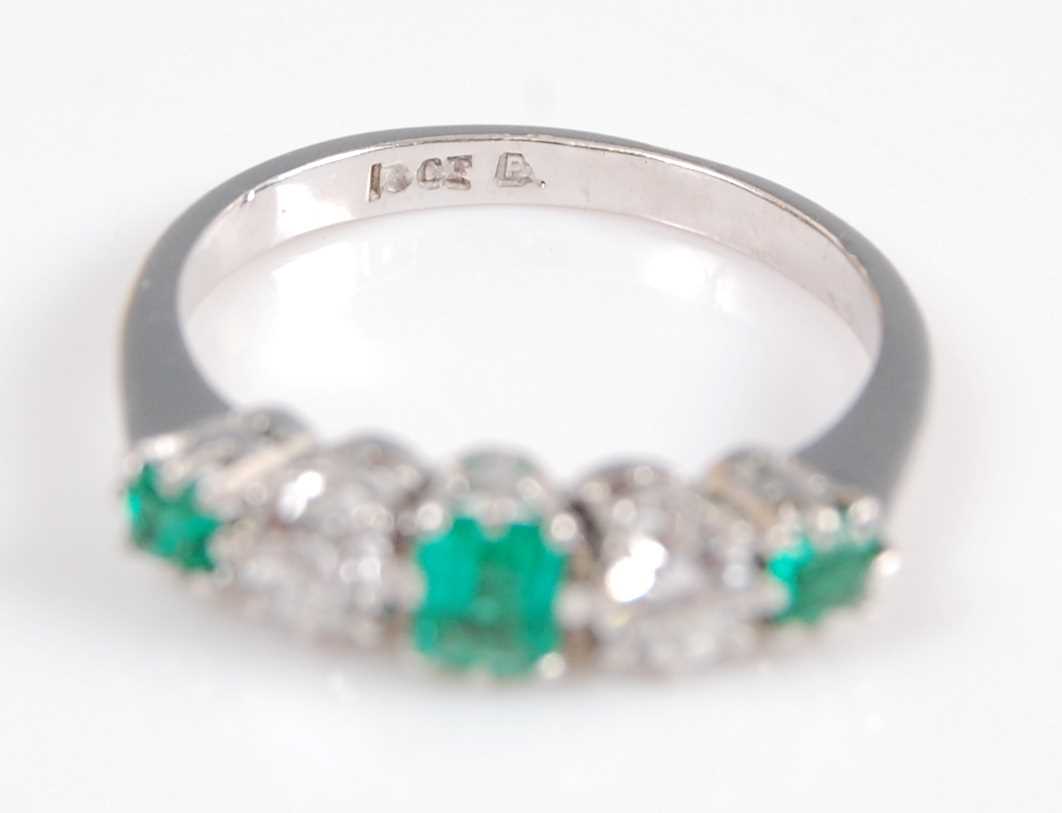 A white metal, emerald and diamond five stone half hoop eternity ring, featuring three graduated - Image 2 of 6