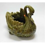 A continental Majolica glazed earthenware jardinière in the form of a swan (some minor losses), h.