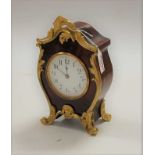 A French style faux red tortoiseshell gilt metal mounted mantel clock, having enamelled dial with