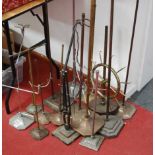 A collection of assorted scientific and industrial adjustable stands etc