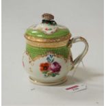 A 19th century continental porcelain custard cup and cover, having gilt and floral