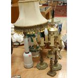 A pair of early 20th century brass four sconce candelabra; together with a turned brass candlestick;