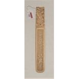 A late 19th century Chinese Canton ivory page-turner, the blade carved with various flowers, the