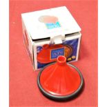 A Le Creuset orange glazed earthenware tagine pot and cover, boxed