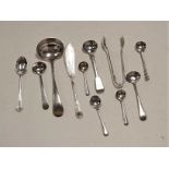 A small collection of loose silver flatware, to include sugar nips, mustard spoons, butter knife