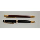 A Mont Blanc Meisterstruck propelling pencil; together with a Must de Cartier ballpoint pen (2)
