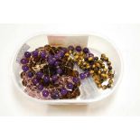 An amethyst glass beaded necklace; together with various other beaded necklaces