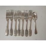 A matched set of seven principally early 19th century silver dessert forks, in the Fiddle pattern;
