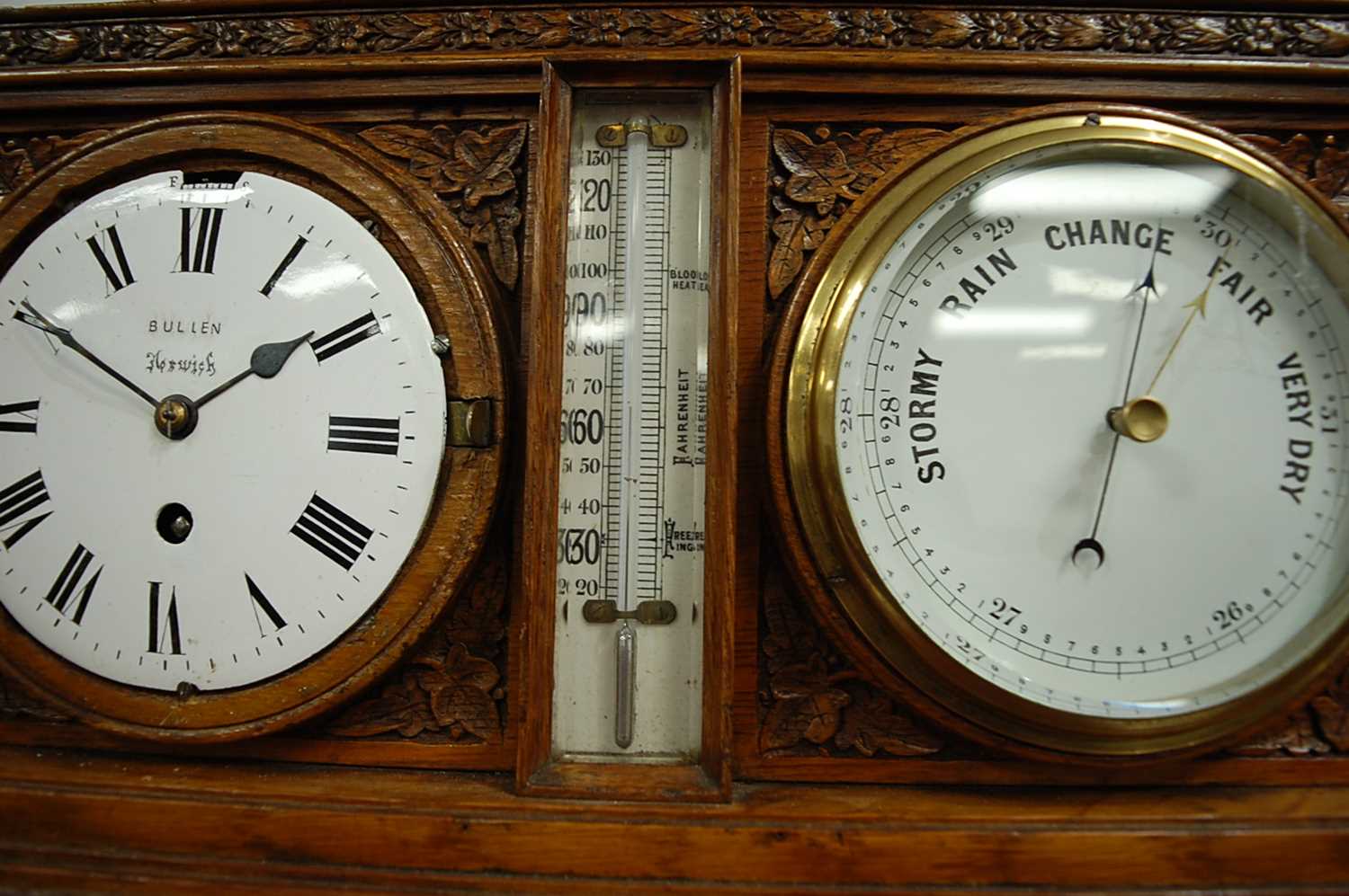 A Victorian carved oak desk weather station, inset with clock and barometer, with central - Image 7 of 9