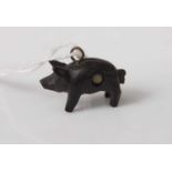 A novelty Stanhope viewer, showing A Memory of Halstead, in the form of a carved ebony(?) pig, 21mm