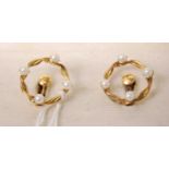 A cased pair of gold plated and faux pearl set ear clips