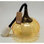 A 1960s amber glass onion shaped hanging pendant ceiling light, having a metal attachment, plastic