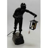 A spelter table lamp in the form of a miner, in standing pose with lantern in hand, h.59cm