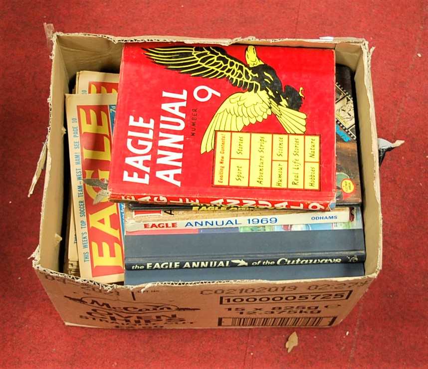 A box of assorted Eagle annuals and comics