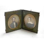 Adolphe Henri Dubasty (1814-1884) - a cased pair of portrait miniatures, being half-length studies