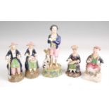 A pair of Victorian Staffordshire figures, the gentleman in seated pose with a spade, her with