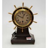 A Sestrel mahogany cased ships wheel balloon shaped mantel clock, having signed silvered dial, h.