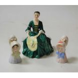 A Royal Doulton figurine 'Lady from Williamsburg', HN2228; together with a pair of Royal Worcester