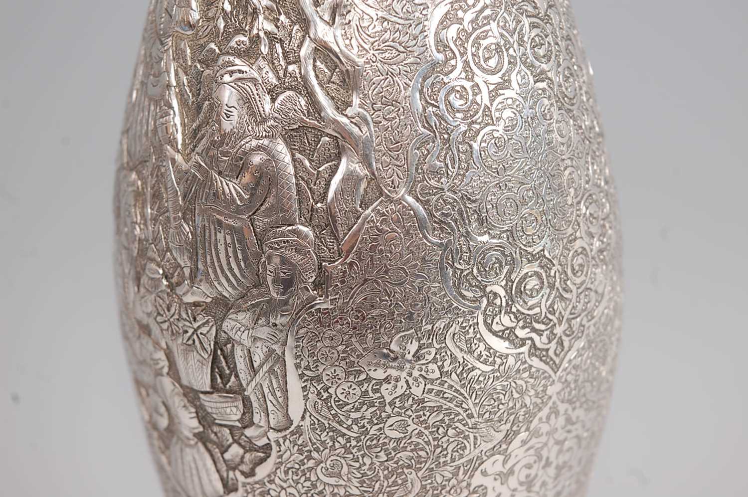 An early 20th century Persian white metal vase, of tulip shape, having all-over foliate engraved - Image 3 of 4