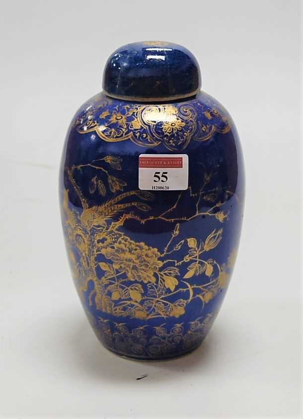 A Japanese stoneware jar and cover, of baluster form, decorated in gilt with exotic birds amidst