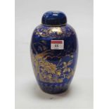 A Japanese stoneware jar and cover, of baluster form, decorated in gilt with exotic birds amidst