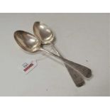 A pair of Edwardian silver tablespoons, in the Old English pattern with monogrammed terminals,