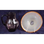 William Wilson (1905-1972) for Whitefriars - a purple tinted glass water jug, of mid-bulbous form,