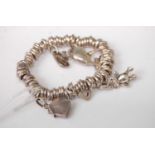 A Links of London white metal bracelet set with charms, 76g