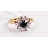 A modern 18ct gold, sapphire and diamond set flower head cluster ring, 4g, size L