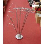 A chrome five branch adjustable sheet music stand