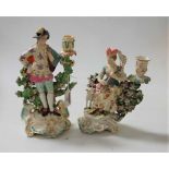 A pair of 18th century Derby porcelain figural candle-holders, modelled as a shepherd and